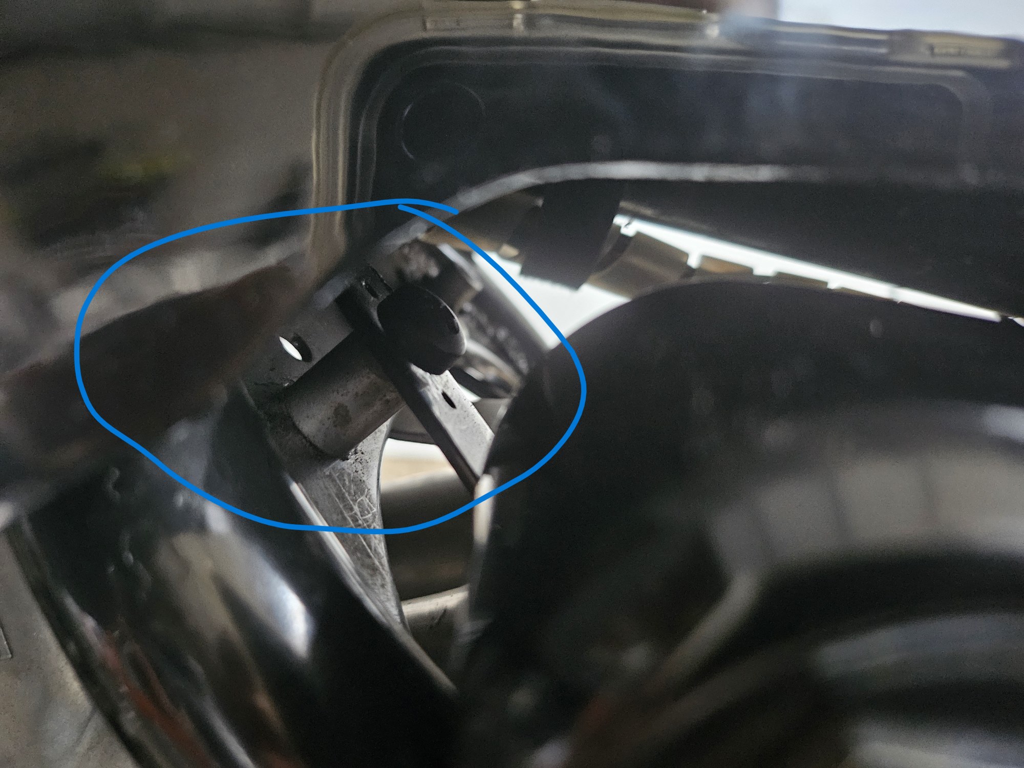 Photo of the bolt to remove the cover